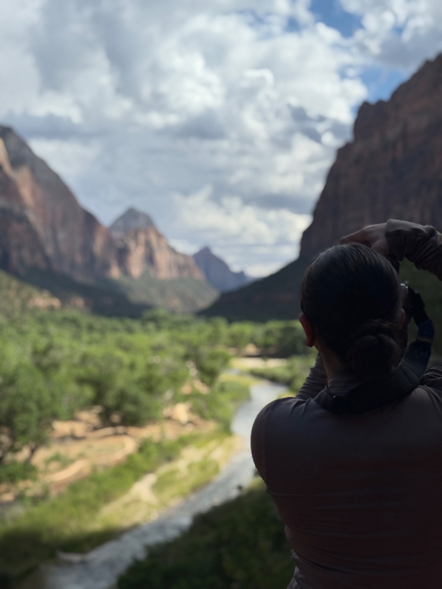 Mari photographing a mountain landscape