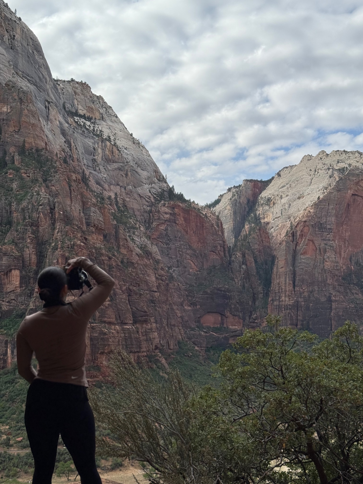 Mari photographing a mountain landscape