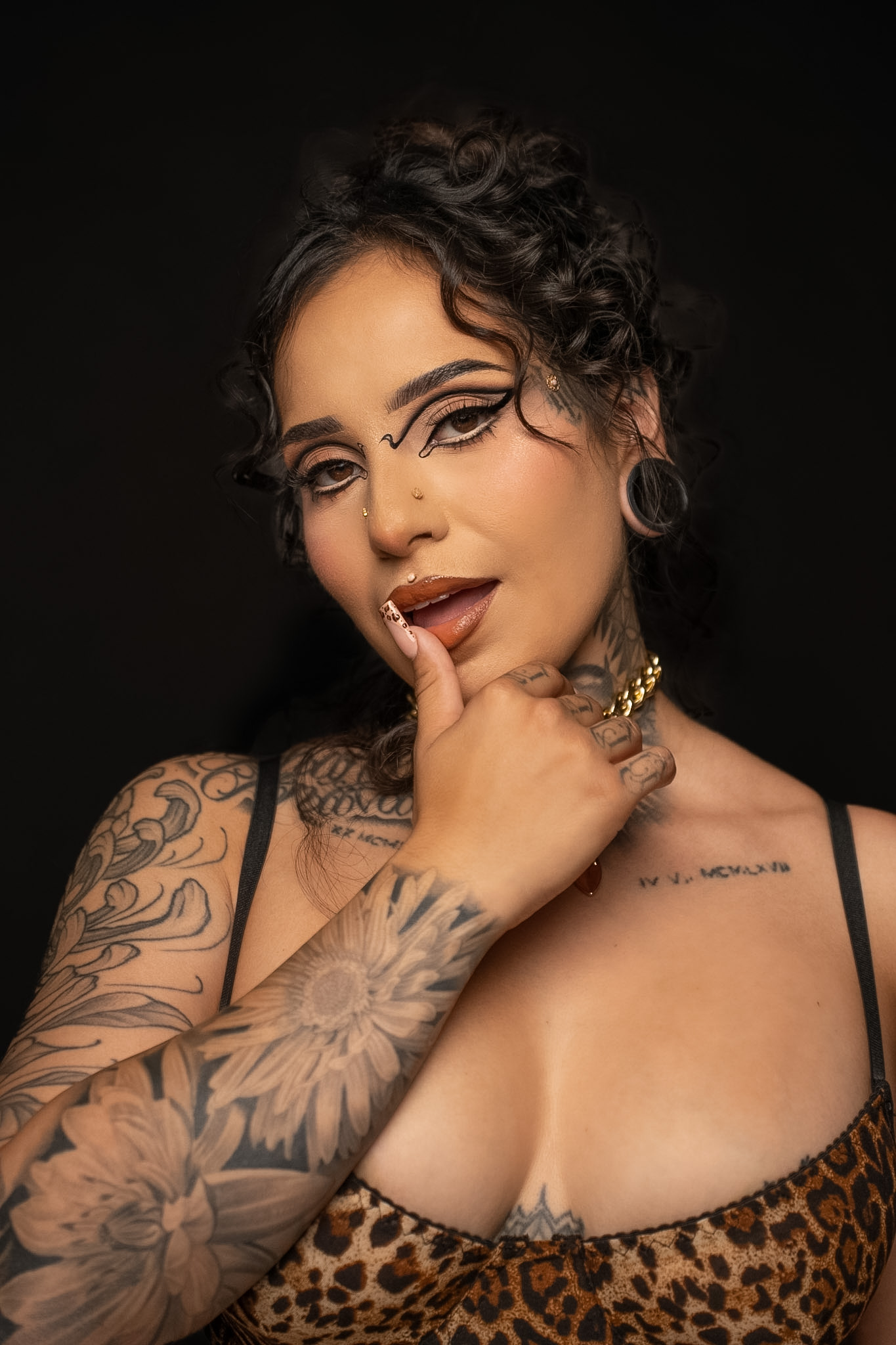 Detailed studio portrait photographed against a black background